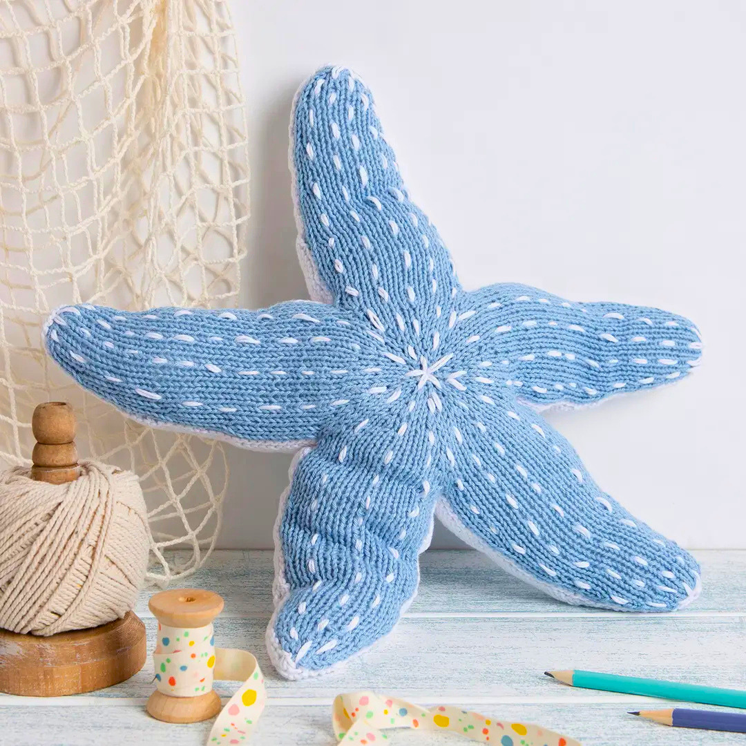 Completed Savanna Starfish knitted toy displayed as coastal inspired home décor.