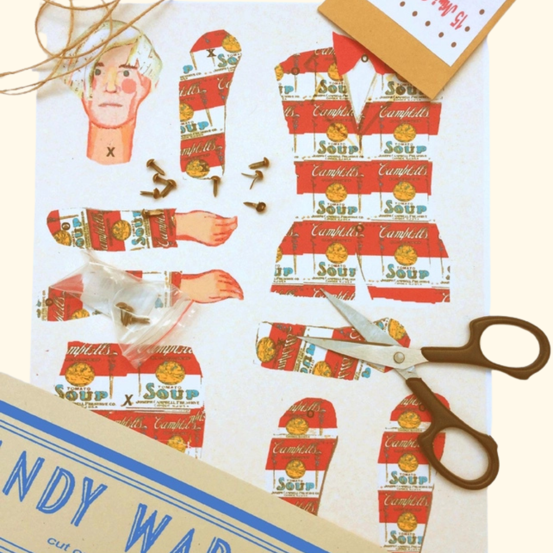 Andy Warhol Cut & Make Paper Puppet Kit contents by Wini Tapp with scissors and paper pieces