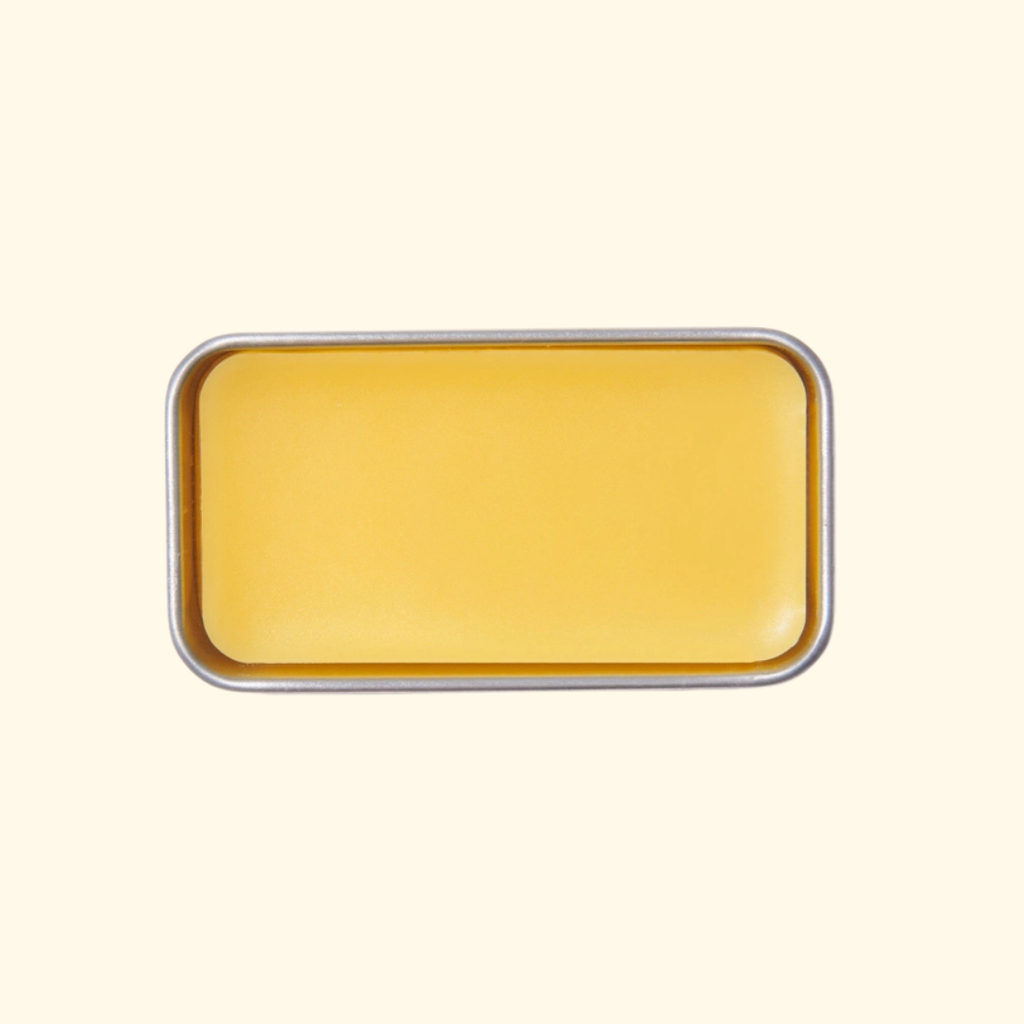 Open rectangular gold tin of SOHMO Australian Beeswax Thread Conditioner, showing the smooth golden beeswax surface.