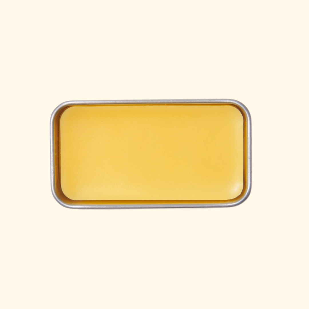 Open rectangular gold tin of SOHMO Australian Beeswax Thread Conditioner, showing the smooth golden beeswax surface.