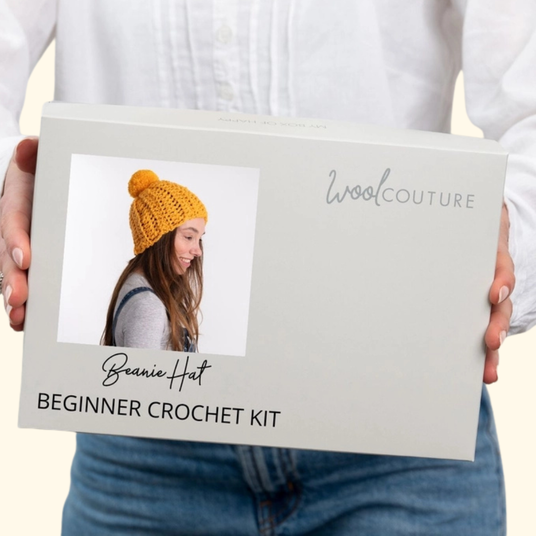 Gift box packaging for the Wool Couture Beanie Crochet Kit featuring the finished beanie design.