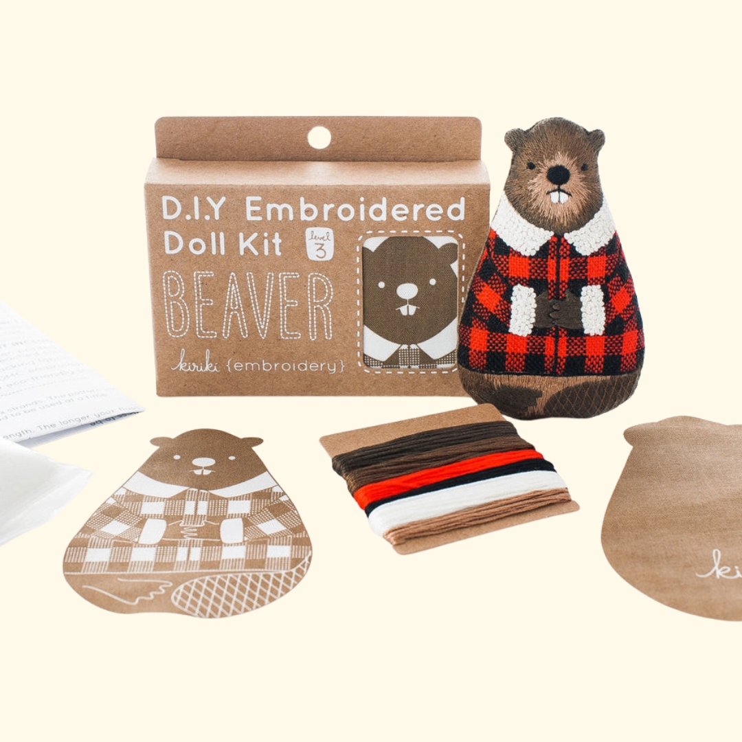 Beaver Embroidery Kit contents including printed fabric, embroidery floss, hoop and instructions.