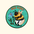 Bee Kind embroidered iron on patch by Anna Seed Art featuring a bumblebee with the words "Bee Kind".