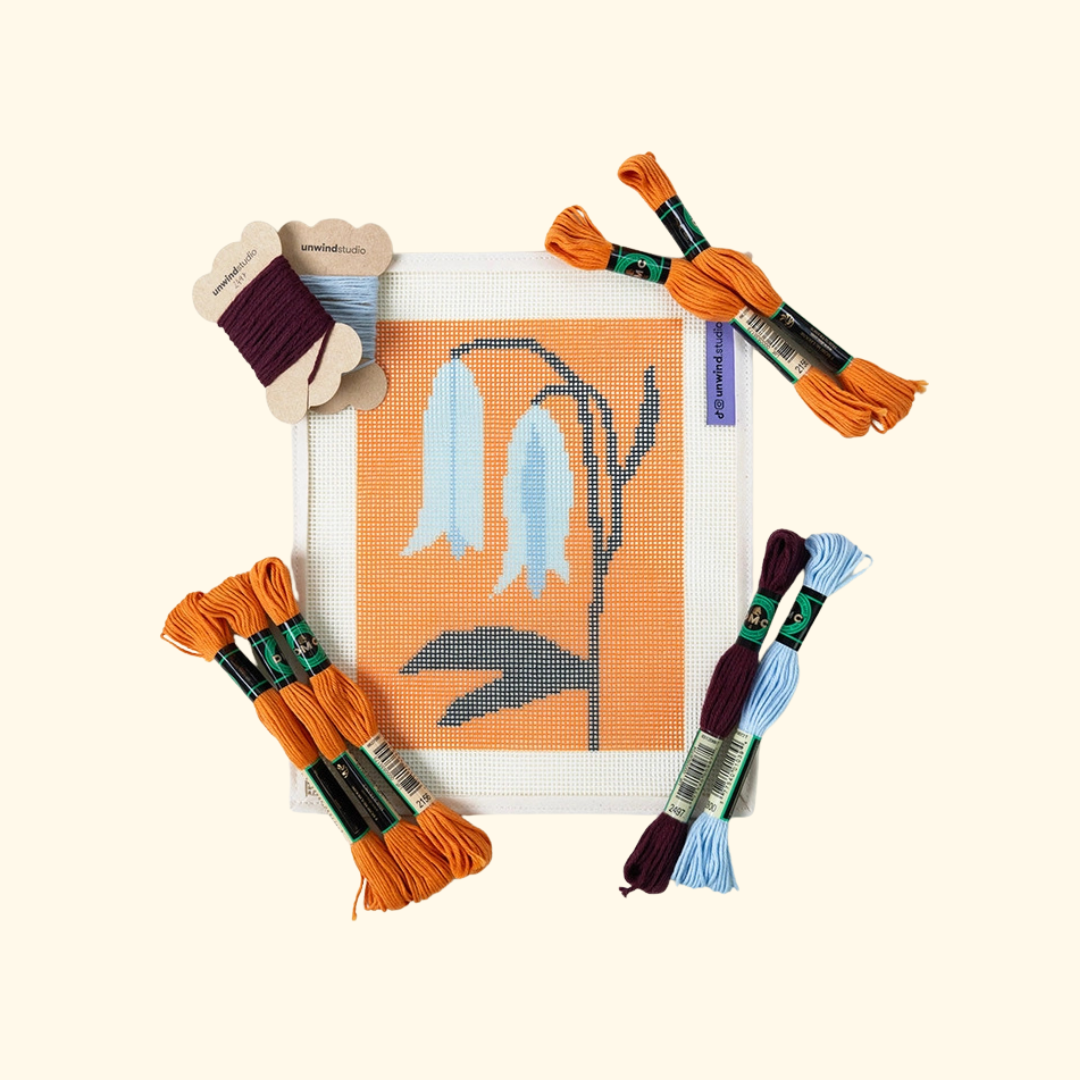 Bellwort Needlepoint Kit by Unwind Studio with printed canvas and product packaging