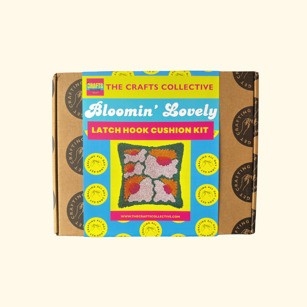Bloomin Lovely Latch Hook Cushion Kit by The Crafts Collective in colourful gift box packaging.