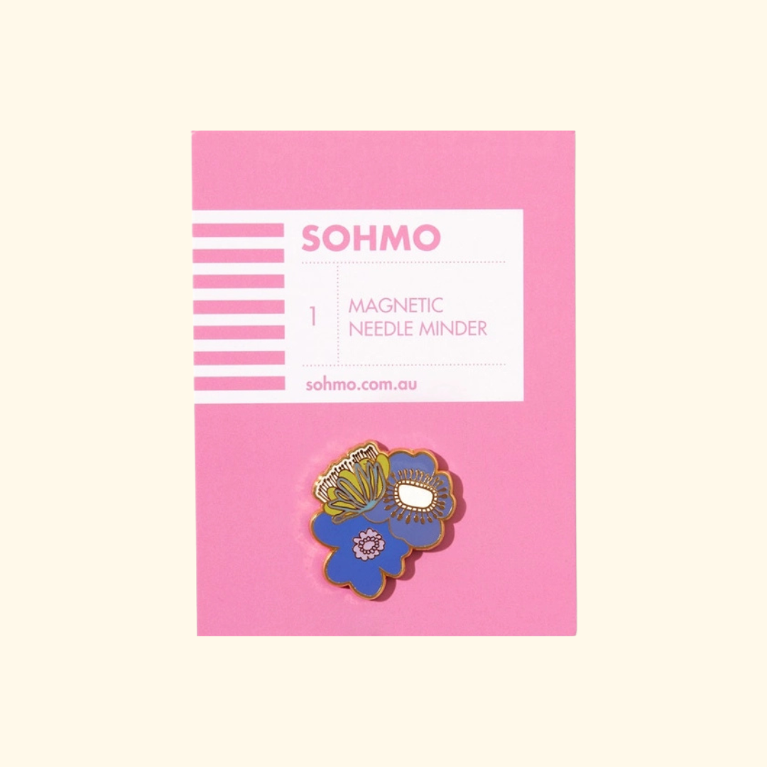 Blue Blooms Magnetic Needle Minder by SOHMO featuring blue, green and pink enamel flowers on pink packaging