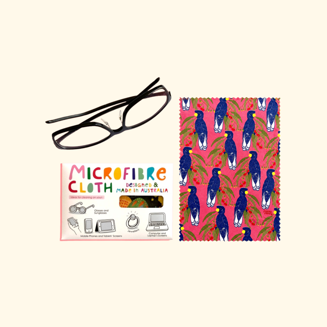 Blue Cockatoo microfibre cloth by Missy Minzy shown folded beside its colourful product packaging.