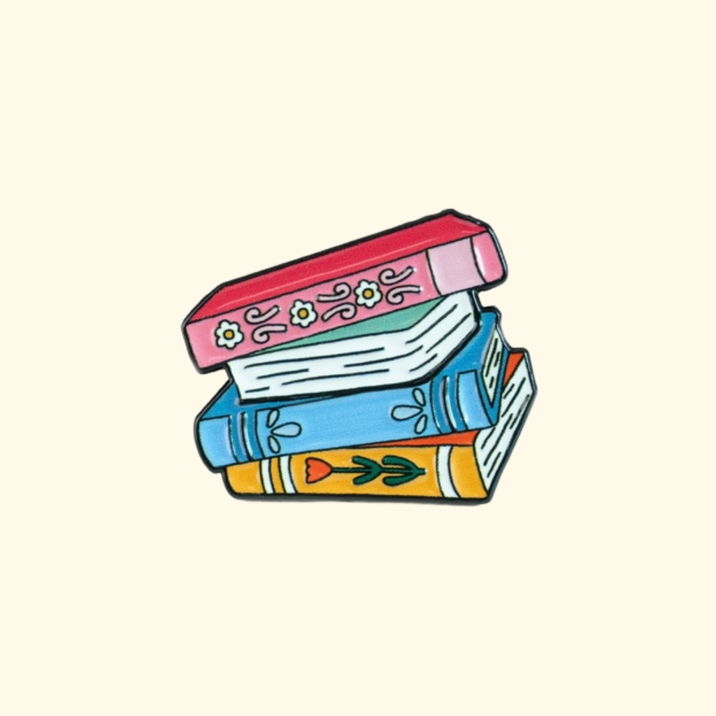 Colourful Book Lovers magnetic needle minder featuring a stack of books.