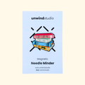 Book Lovers magnetic needle minder by Unwind Studio shown in its branded packaging.