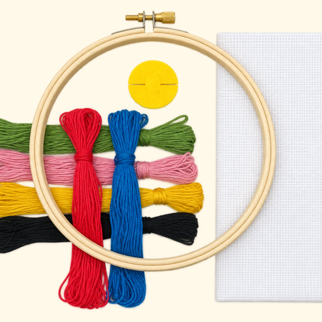 Brightside Grid Cross Stitch Kit by Budgie Goods with embroidery hoop, colourful threads, fabric and instructions.
