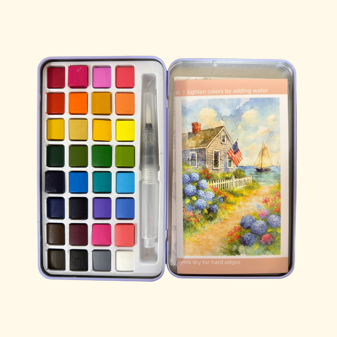 Travel-sized watercolour paint palette and Cape Harbor artwork included with the Cate Paper Co painting kit.