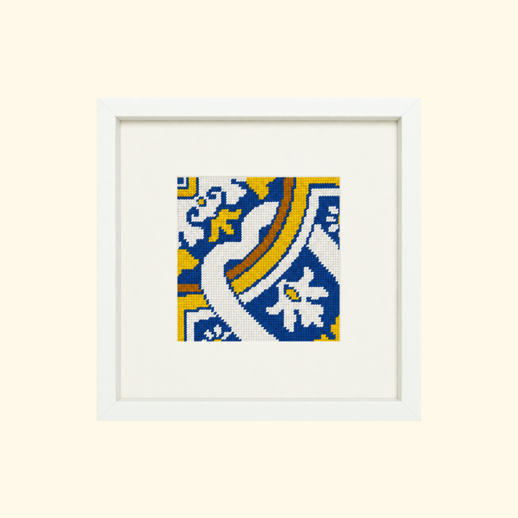 Finished Cedofeita needlepoint design featuring a blue, white and yellow Portuguese tile pattern in a cream frame.