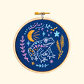 Finished Celestial Frog mini embroidery hoop stitched with moon, stars and floral design by Hawthorn Handmade.