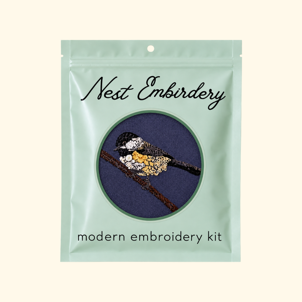 Nest Embirdery Chickadee Mini Embroidery Kit packaging featuring the completed bird embroidery design.