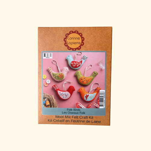 Corinne Lopierre Folk Birds Wool Mix Felt Craft Kit in its original brown cardboard packaging, featuring a photo of colorful felt bird ornaments on a pink background.