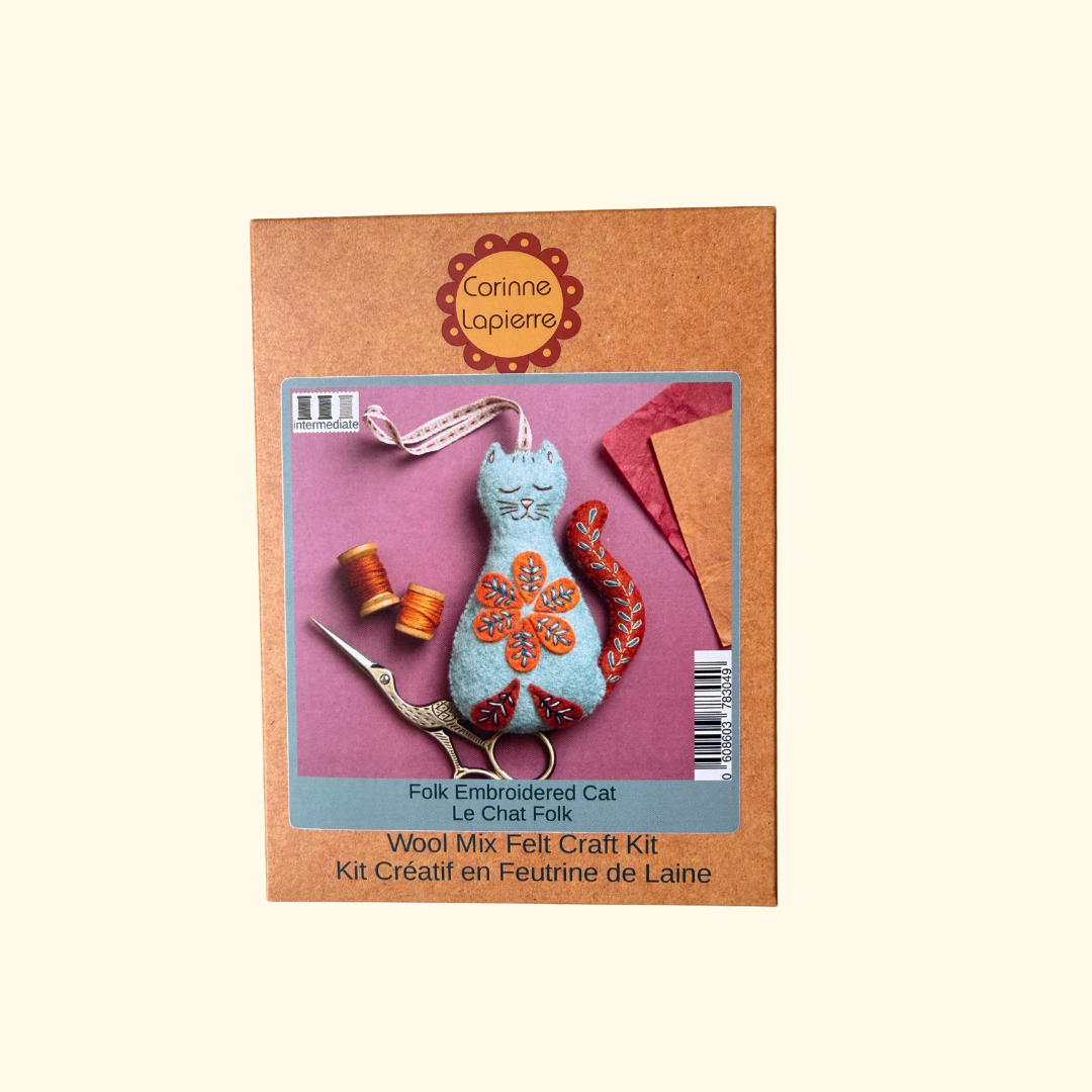 Corinne Lapière Wool Mix Felt Craft Kit for making a folk embroidered cat, shown in its brown cardboard packaging against a light cream background.