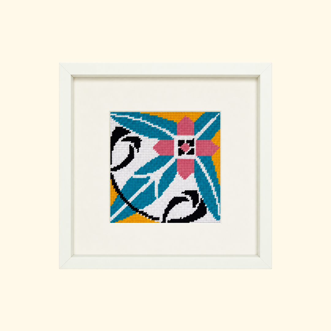 Finished Costa Cabral needlepoint design featuring a colourful geometric Portuguese tile pattern in a cream frame.