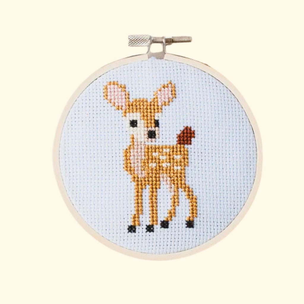 Completed deer cross stitch design stitched in an embroidery hoop by Cotton Clara.