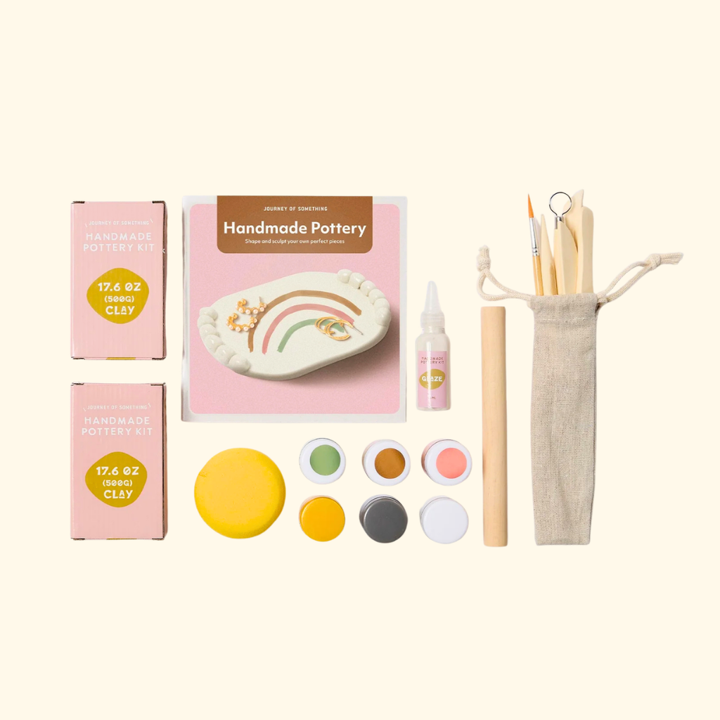 Deluxe pottery kit contents including paints, clay, tools and instruction booklet