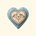 Finished embroidered heart felt craft kit by Corinne Lapierre displayed against a plain background.