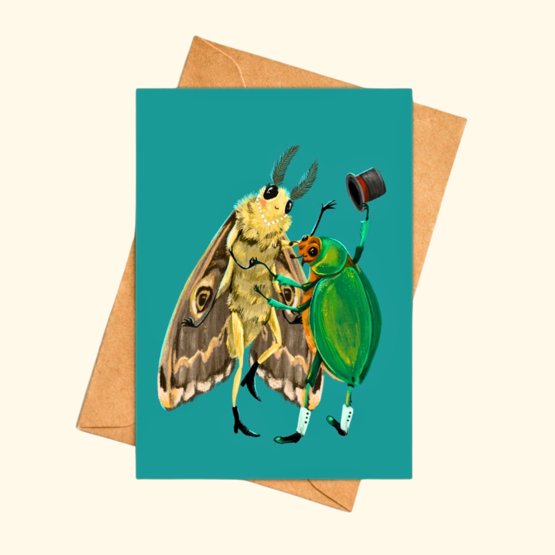 Fancy Dancing greeting card shown with a matching kraft envelope, featuring a whimsical moth lady dancing with a beetle gent holding his top hat.