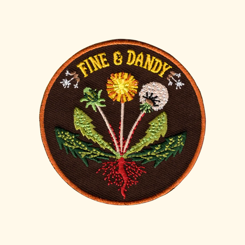 Fine & Dandy embroidered iron on patch by Anna Seed Art featuring colourful dandelions and wildflowers with the words "Fine & Dandy".