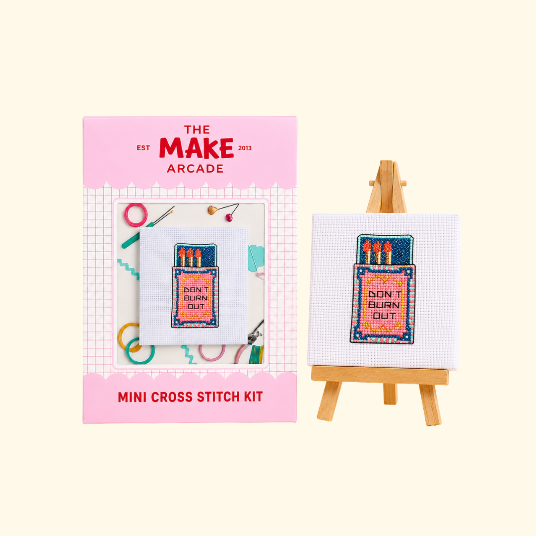 Flamin Hot Mini Cross Stitch Kit by The Make Arcade with packaging and finished stitched design on a mini easel.