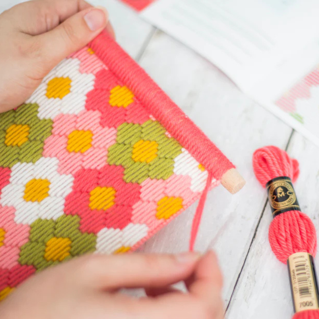 Hands stitching the Flower Power Bargello Wall Hanging Kit using colourful bargello needlepoint techniques