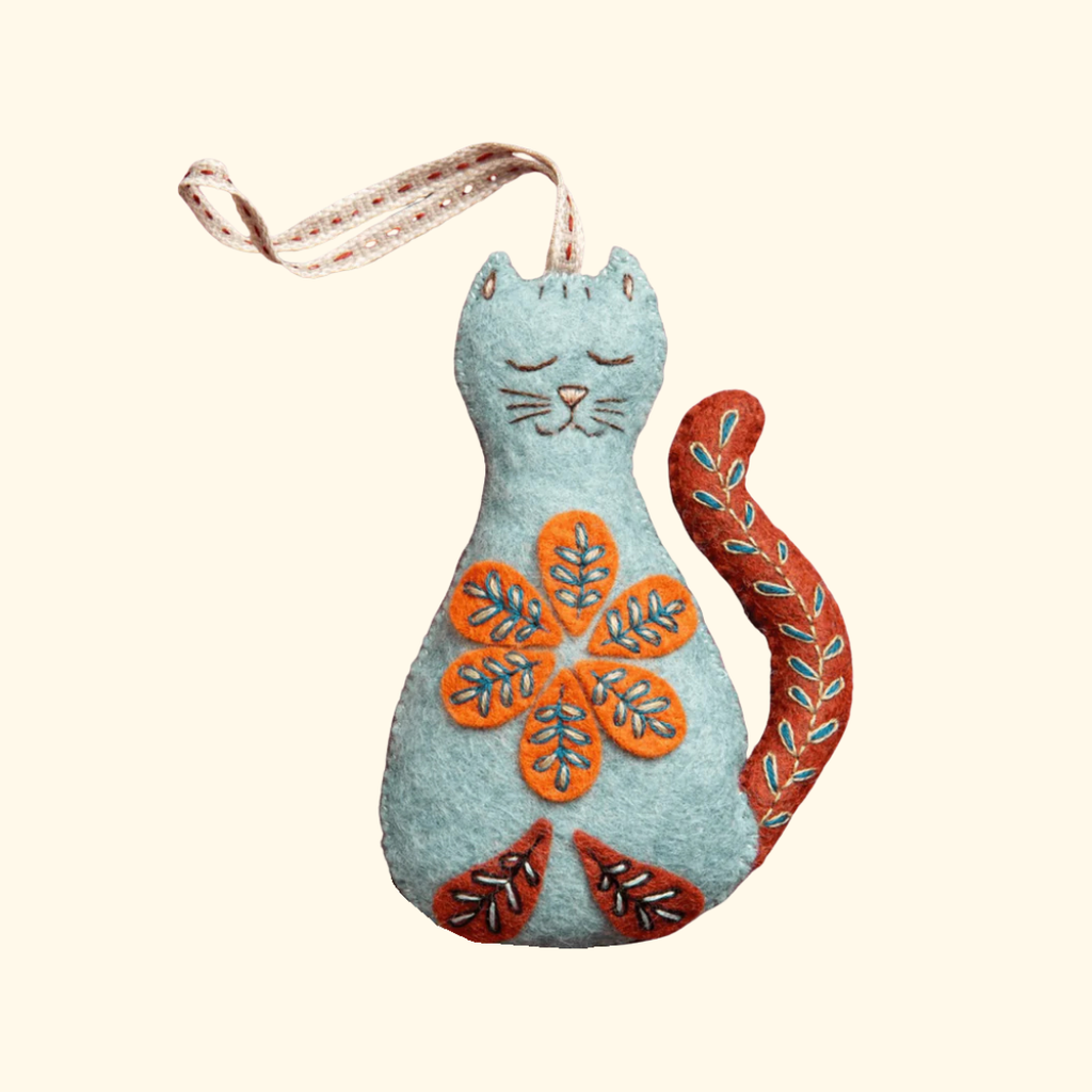 Finished Folk Cat felt craft kit by Corinne Lapierre displayed against a plain background.