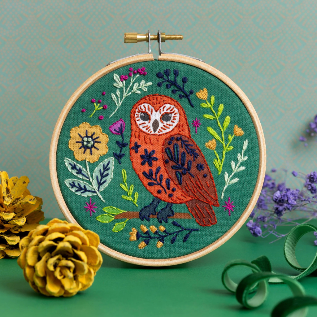 Finished folk owl embroidery display with buttons, ribbon, fabric and thread.
