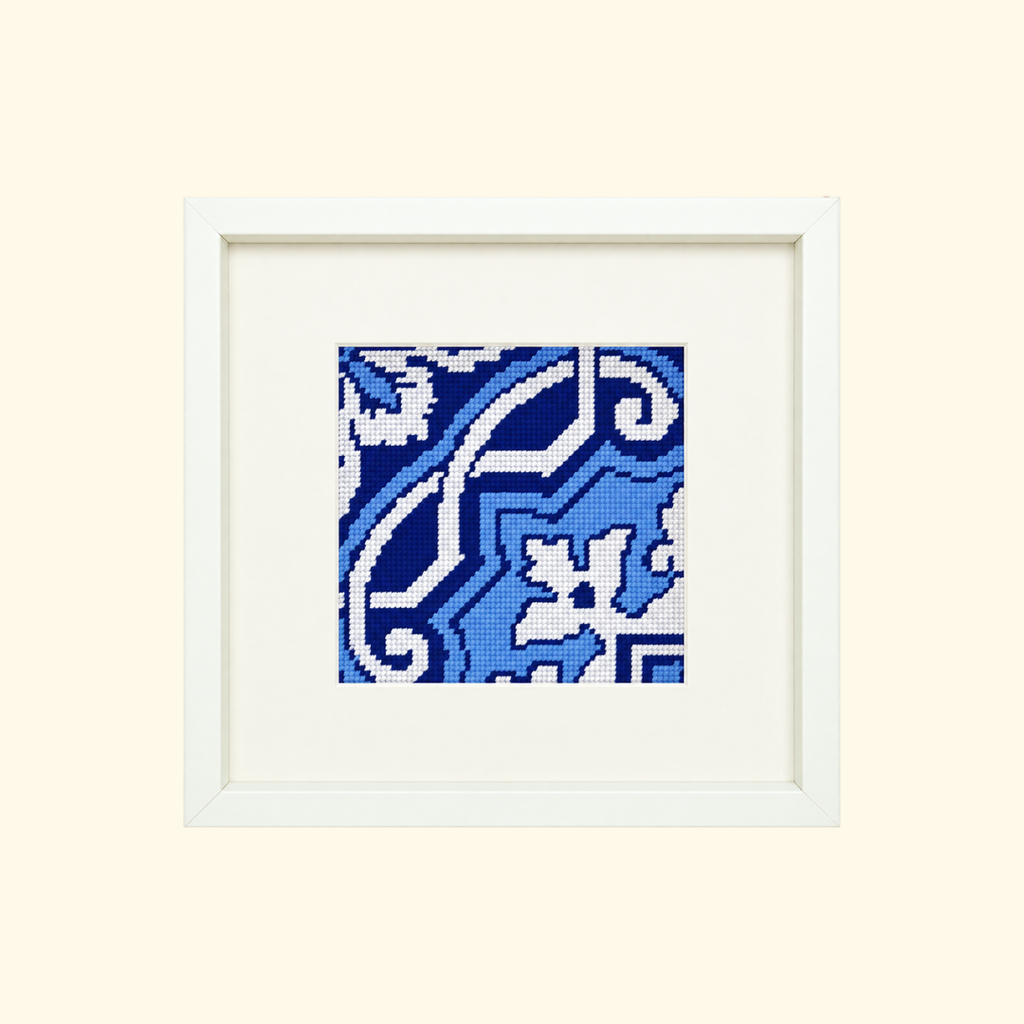 Finished Fontainhas needlepoint design featuring a blue and white Portuguese tile pattern in a cream frame.