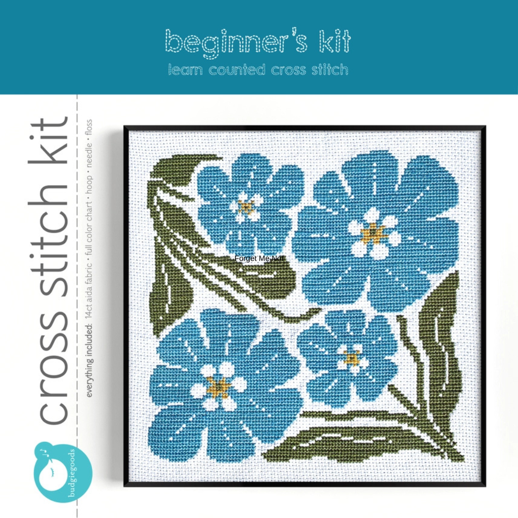 Forget Me Not Grid Cross Stitch Kit by Budgie Goods in its original packaging featuring the completed blue floral design.