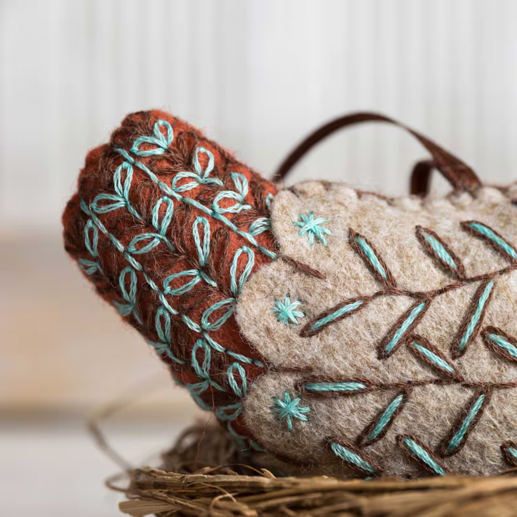 Close up of decorative embroidery details on the French Hen felt craft kit by Corinne Lapierre.