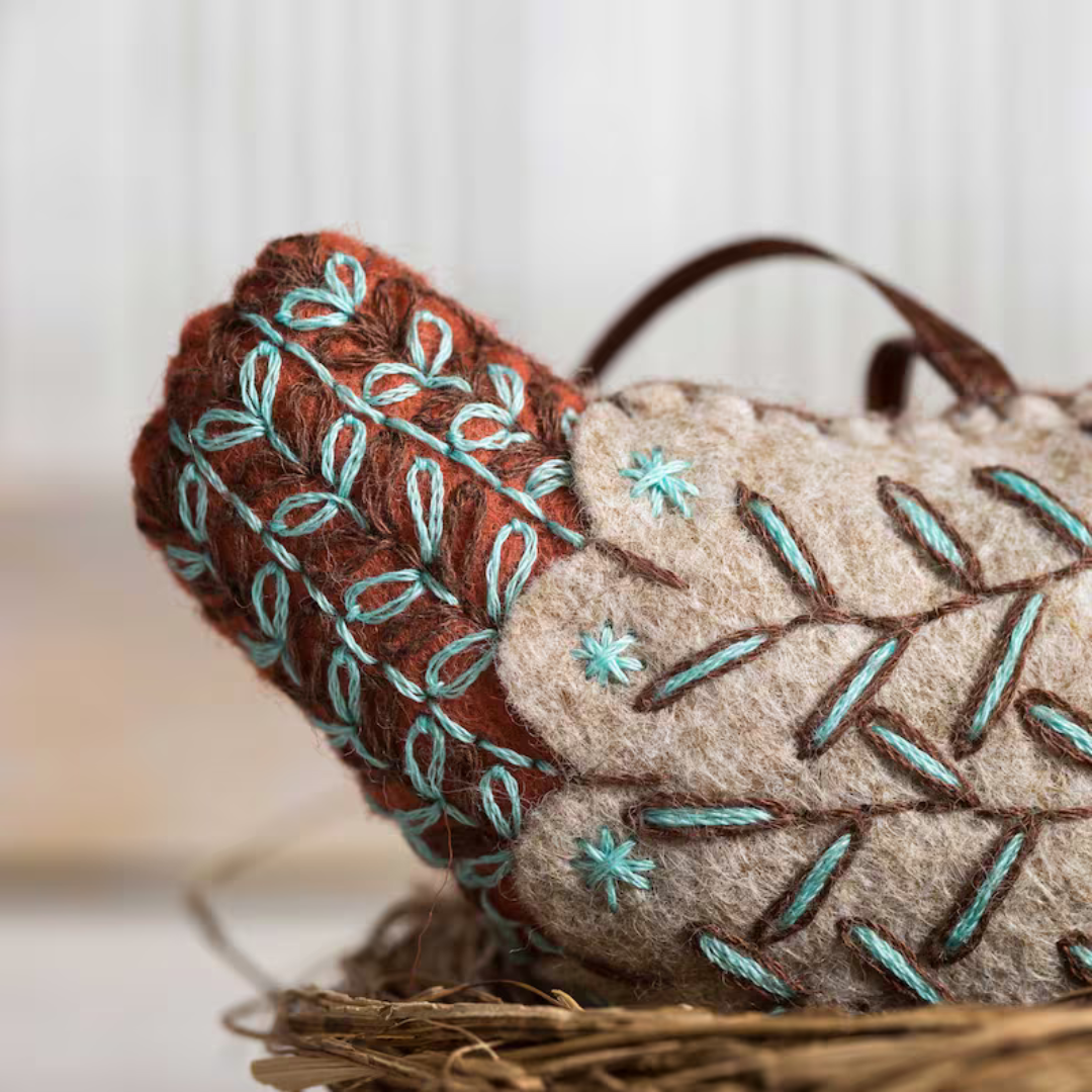 Close up of decorative embroidery details on the French Hen felt craft kit by Corinne Lapierre.