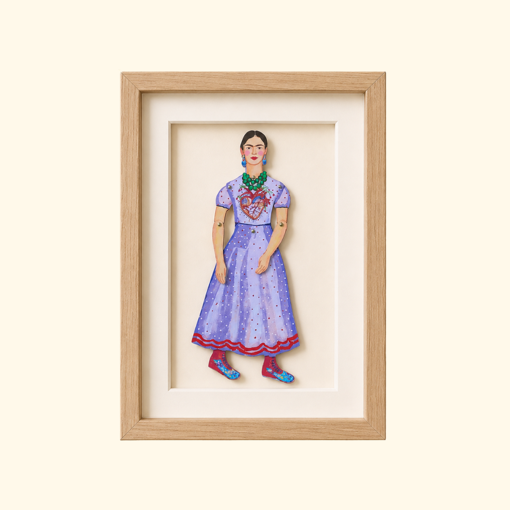Frida Kahlo paper puppet by Wini Tapp displayed finished in a wooden frame