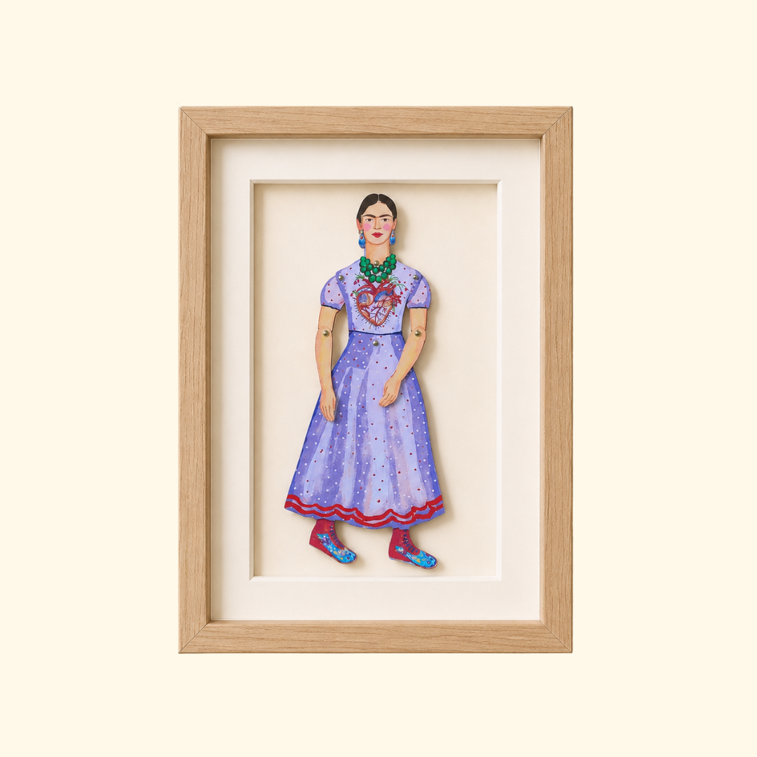 Frida Kahlo paper puppet by Wini Tapp displayed finished in a wooden frame