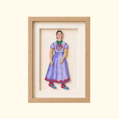 Frida Kahlo paper puppet by Wini Tapp displayed finished in a wooden frame