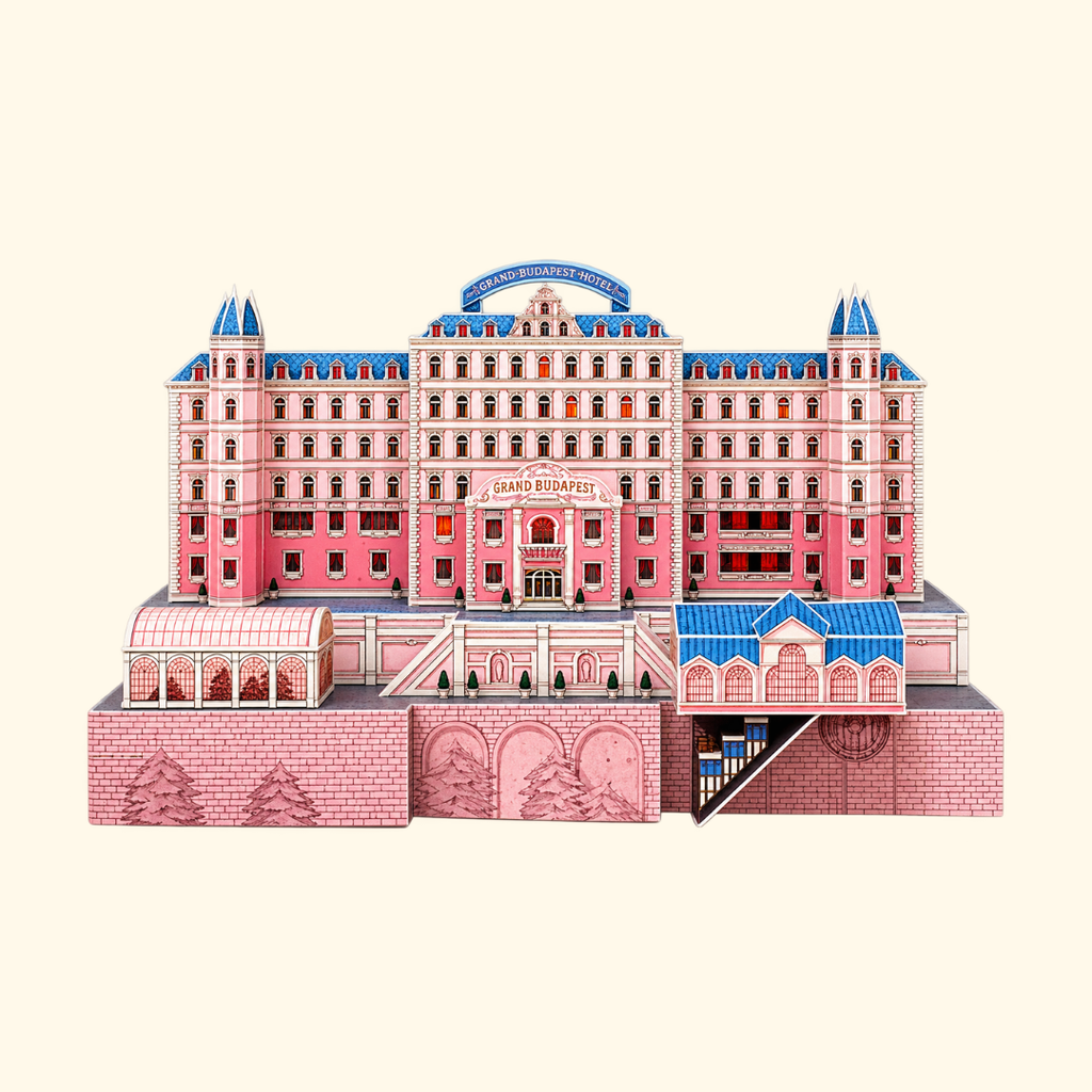 Completed Grand Budapest Hotel paper model kit by Kiko Ilustrador, recreating the iconic pink hotel from Wes Anderson's The Grand Budapest Hotel with its distinctive architecture.