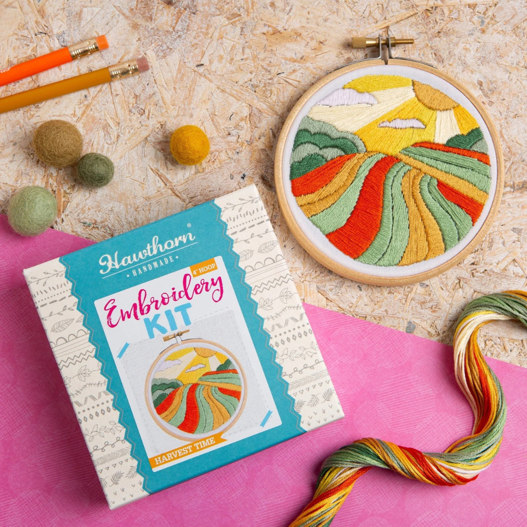 Harvest Time Mini Embroidery Kit by Hawthorn Handmade showing both the gift box and completed embroidered harvest landscape artwork.