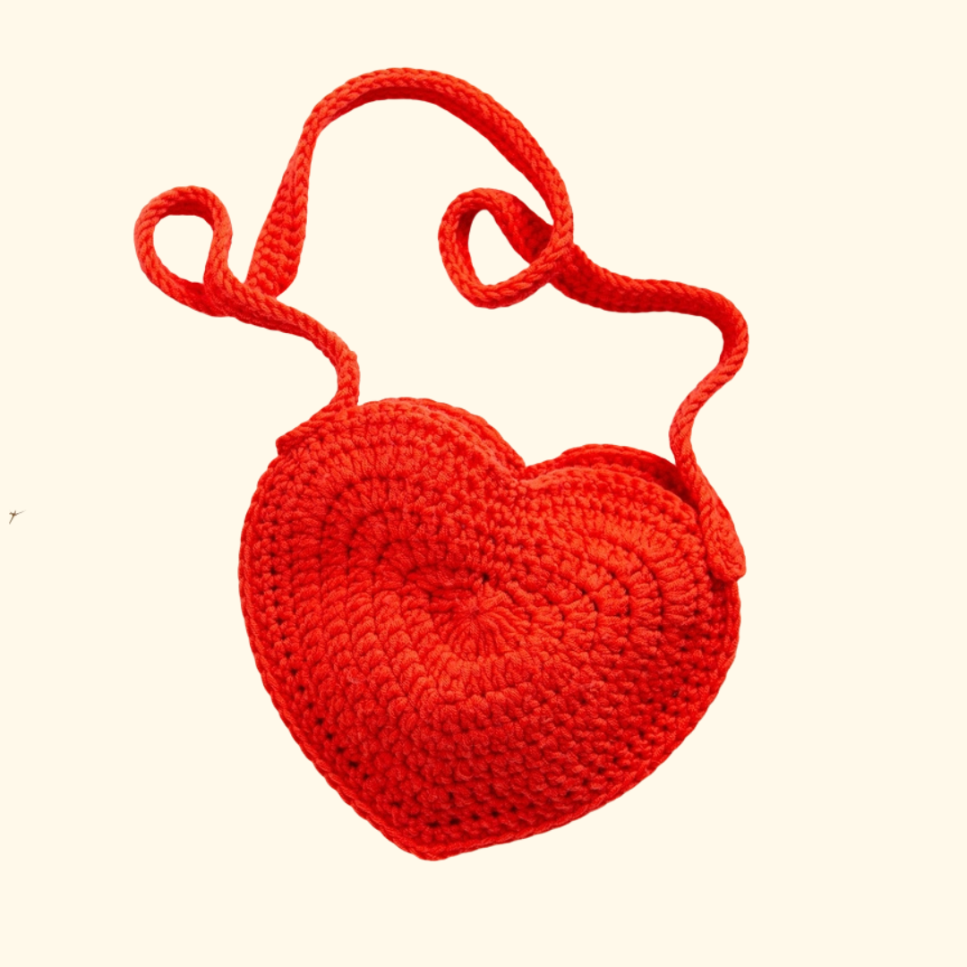 Completed heart shaped crochet bag made with the Wool Couture Heart Bag Crochet Kit.