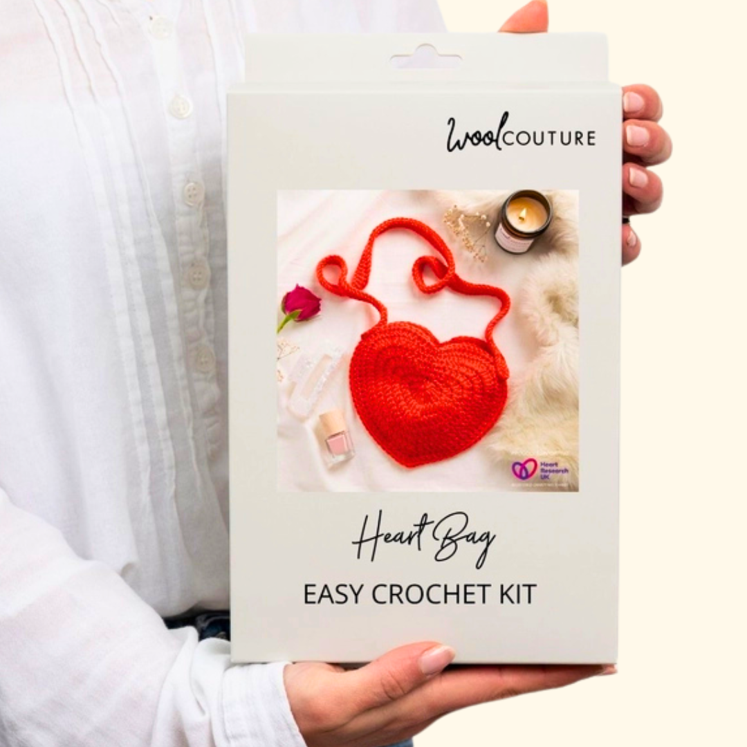 Gift box packaging for the Wool Couture Heart Bag Crochet Kit featuring the finished bag design.