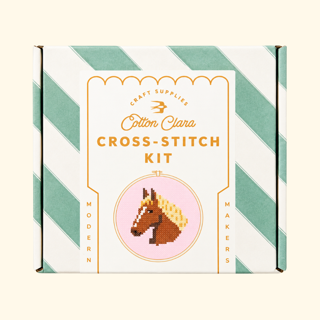 Cotton Clara Horse Cross Stitch Kit in its mint green and white striped presentation box.