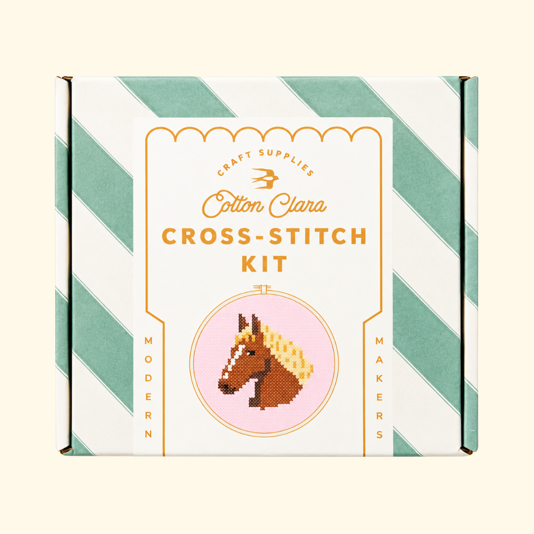 Cotton Clara Horse Cross Stitch Kit in its mint green and white striped presentation box.