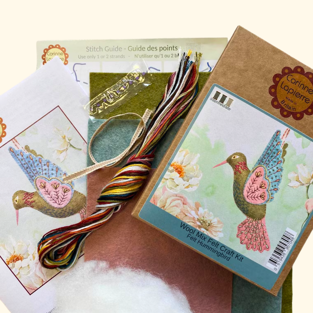 Contents of the Hummingbird Felt Craft Kit by Corinne Lapierre including felt pieces, embroidery threads, stuffing, needle and instructions.