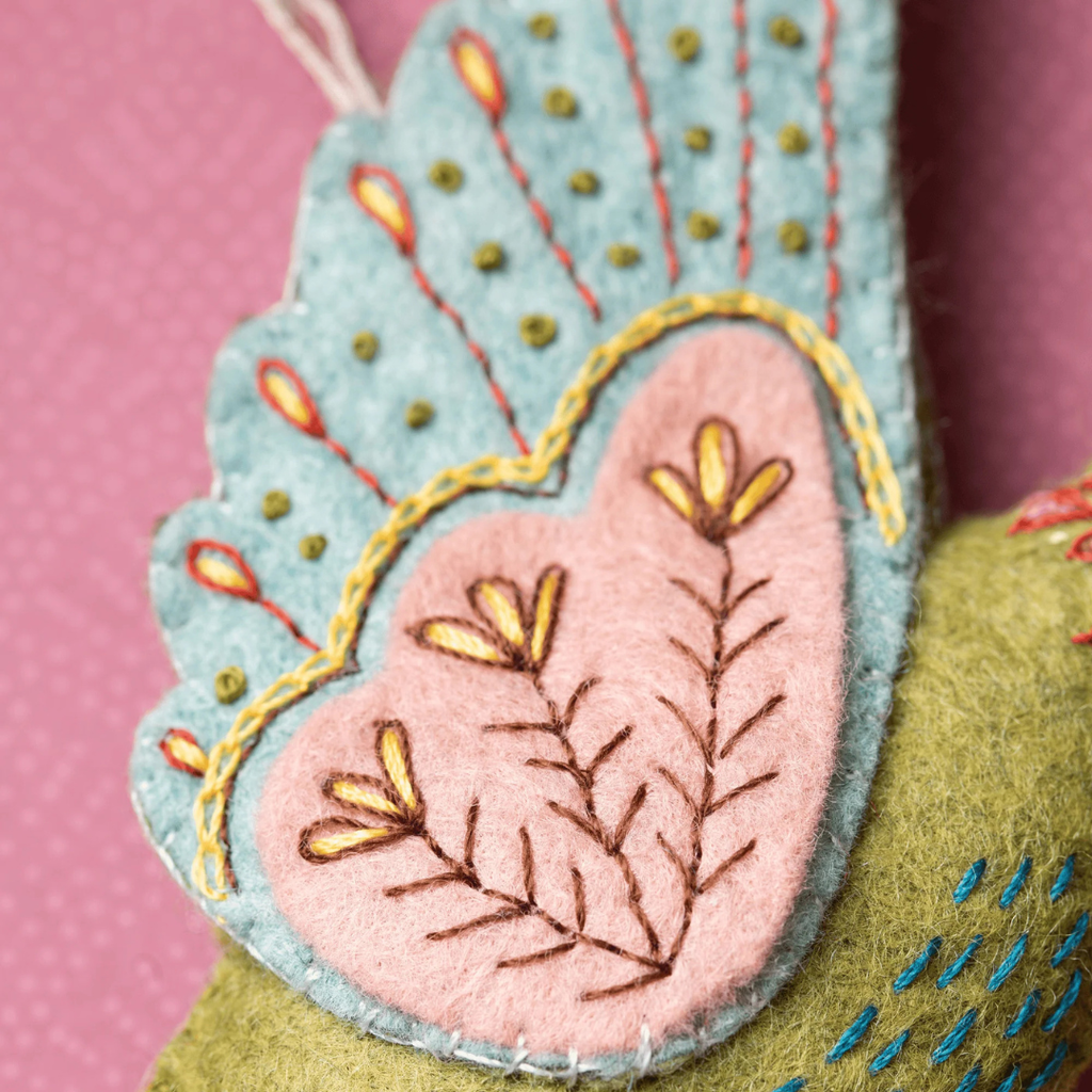 Close up of decorative embroidery and felt applique on the hummingbird wing from the Hummingbird Felt Craft Kit by Corinne Lapierre.