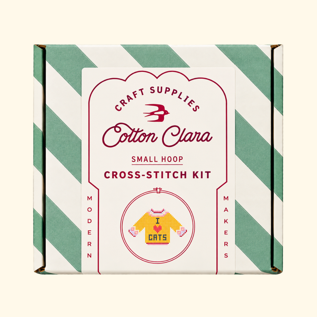 Cotton Clara I Love Cats Cross Stitch Kit in its mint green and white striped presentation box.