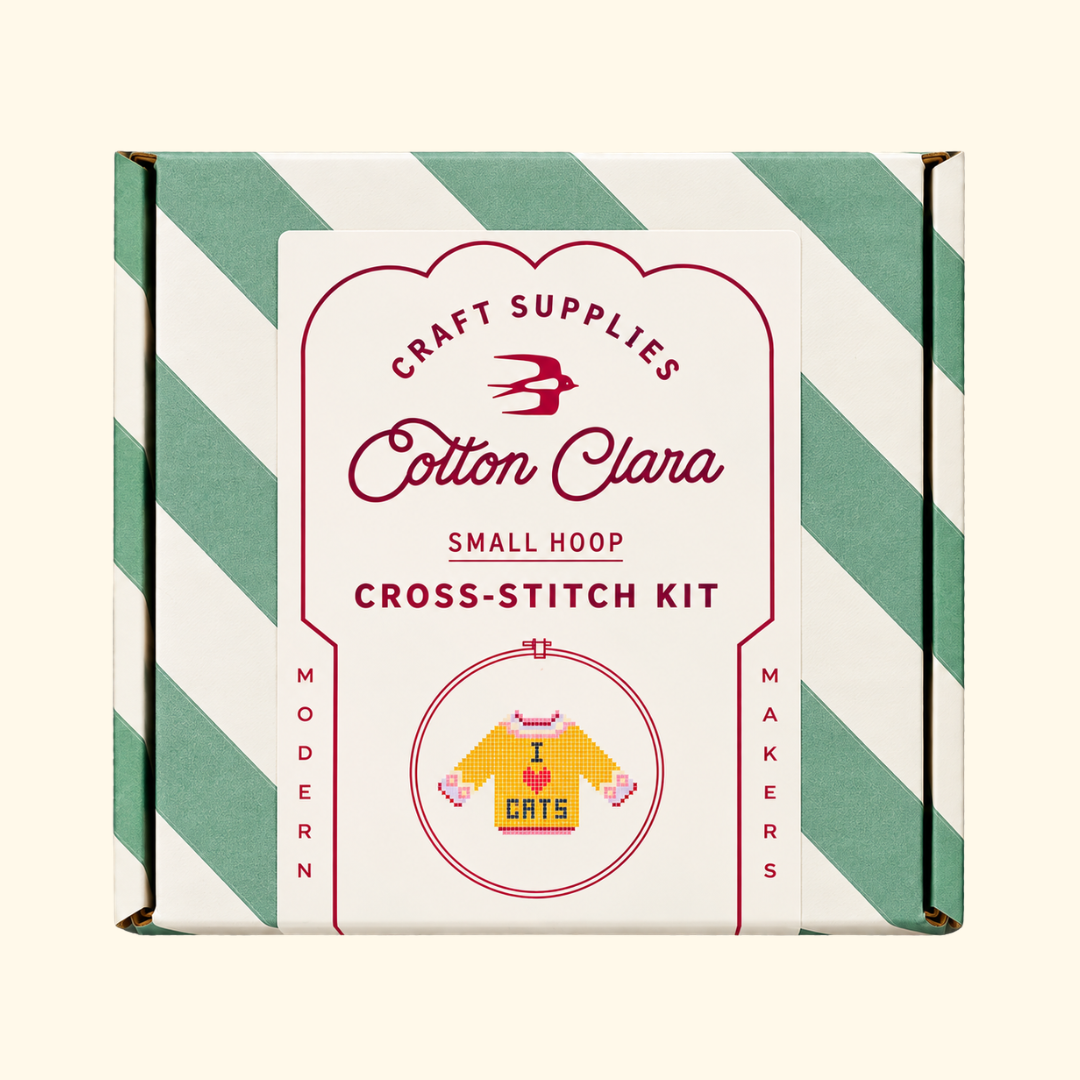 Cotton Clara I Love Cats Cross Stitch Kit in its mint green and white striped presentation box.