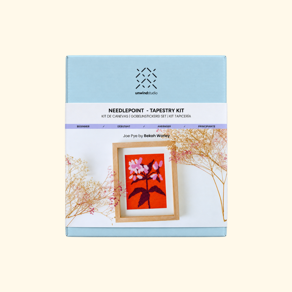 Joe Pye Weed Needlepoint Kit by Unwind Studio with floral canvas and pale blue packaging
