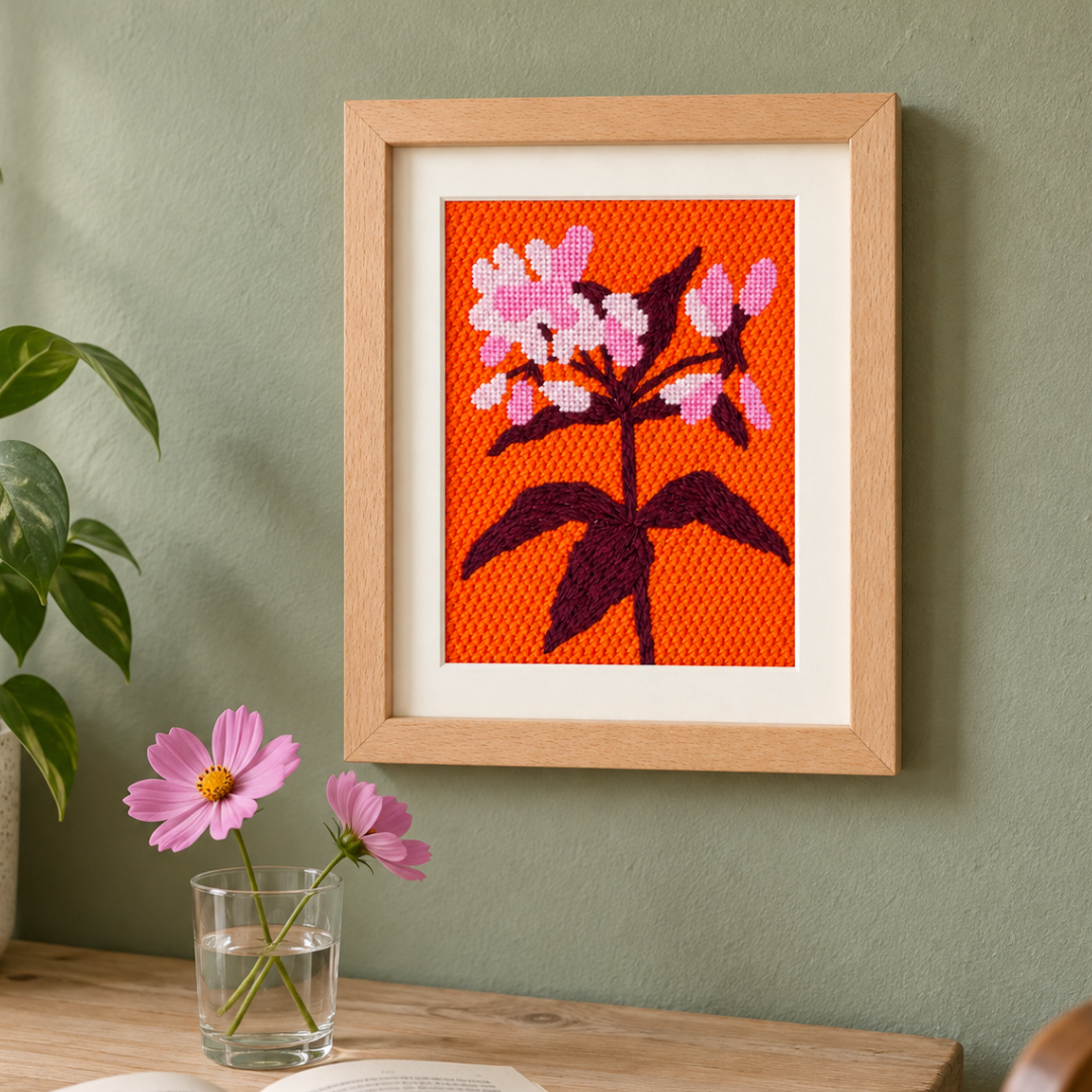 Finished Joe Pye Weed needlepoint design framed and displayed as floral wall art