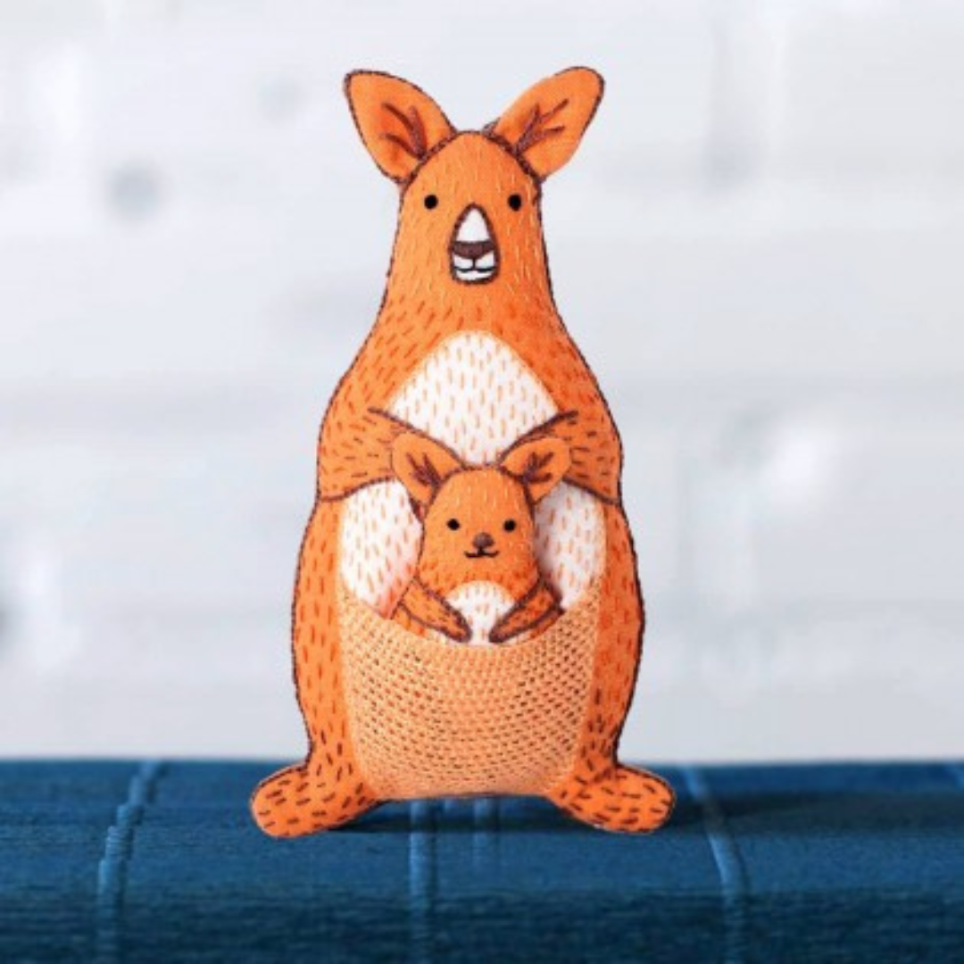 Finished kangaroo embroidery kit displayed on a shelf